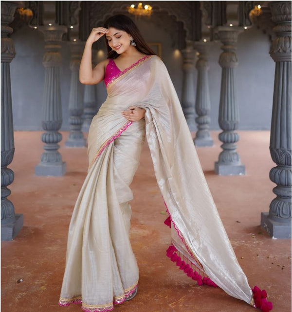 Classy Gold and Pink Saree with Glossy Finish and Tassel Accents